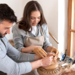 Couple participating in a pottery class